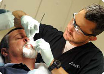 Dr. Chad Thomas performing Mohs surgery at Dermatology Associates of the Tri-Cities